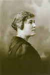 Image shows the portrait of a woman in profile. 