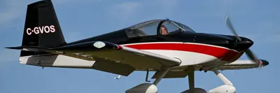 Image shows an airplane in flight. 