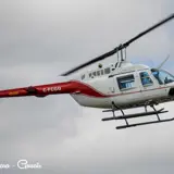 Image shows a helicopter in flight. 