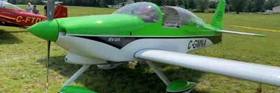 Image shows green and white plane. 