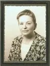 Image shows a picture of a middle-aged woman. 