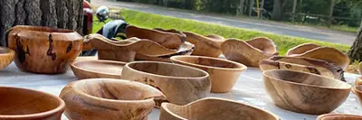 Image shows carved wooden bowls. 